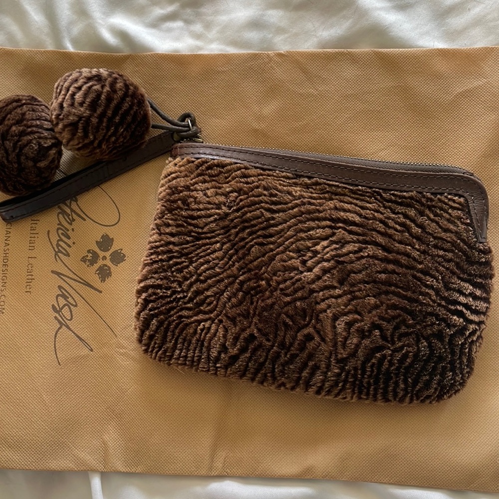 Patricia Nash sheepskin and leather wristlet with Pom poms